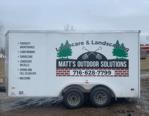 Matts Outdoor Solutions Trailer with phone number and log and landscaping services